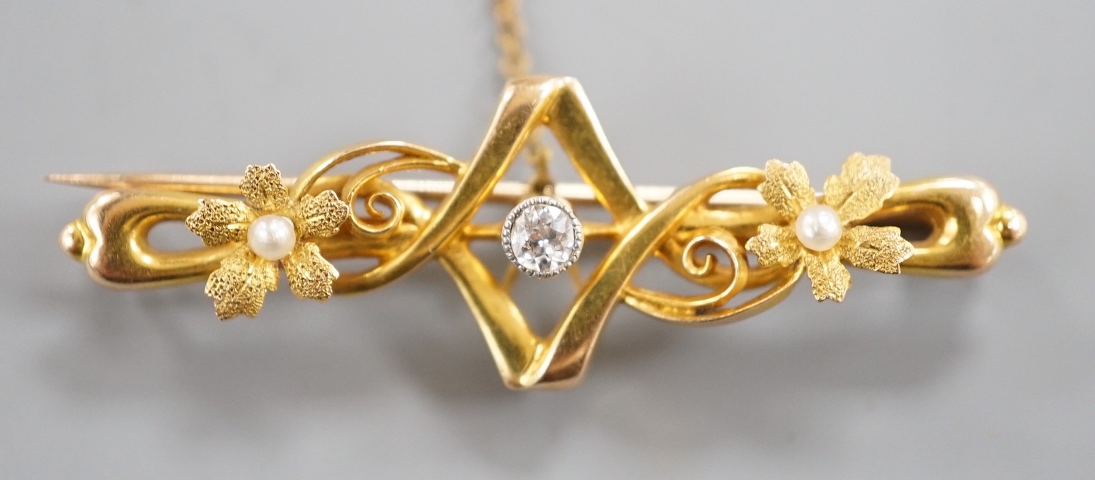 An Edwardian 15ct, seed pearl and diamond set bar brooch, 43mm, gross weight 3.1 grams.